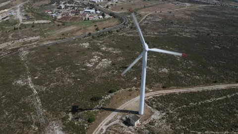 Wind turbines with moving rotating blades in wind energy field with bright blue Stock-Footage 201423566
