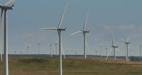 Wind turbines onshore generating clean renewable carbon free energy 4k Scotland Stock Footage 185640837