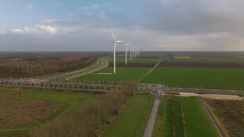 Wind turbines in open farm grass land near Zeewolde clean sustainable energy 스톡 동영상 165238042