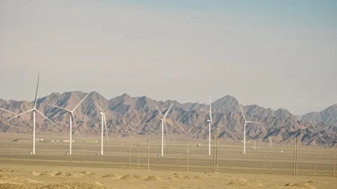 Wind turbines operating in remote desert mountain landscape Stock-Footage 326227025