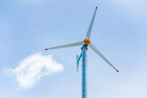 Wind turbines or Wind generators in light blue sky, white clouds background.  Stock Photos