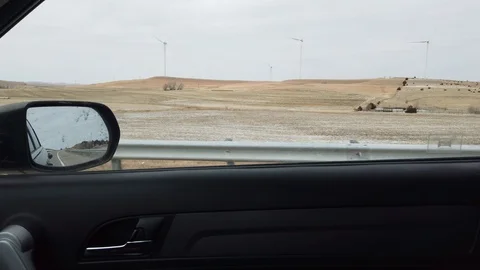 Wind Turbines out the Car Stock Footage 125409746