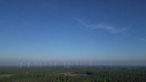 Wind turbines over forest landscape, wide aerial panorama Stock Footage 334679086