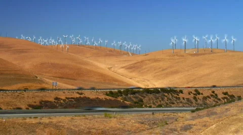 Wind turbines over highway (timelapse) Stock Footage 304889