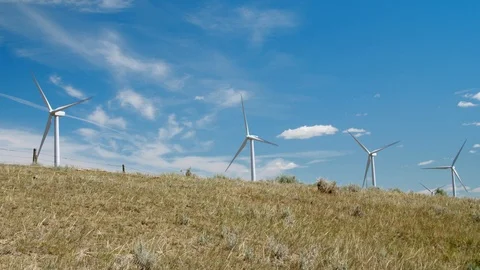Wind turbines over the hill Stock Footage 114896948