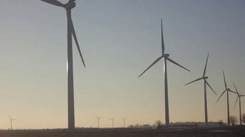 Wind Turbines PAN ACROSS Field in the Sunset HQ 1080p Stock Footage 77326258