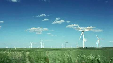 Wind turbines on plateau under cloudy sky Video stock 103087859