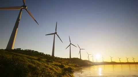 Wind Turbines Power Generators At Lake Coastline At Sunset 스톡 동영상 155430175