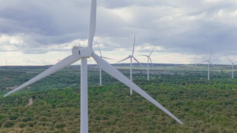 Wind turbines producing clean, renewable energy with rotating blades Видео 336213949