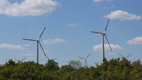 Wind turbines producing renewable clean energy on a sunny day Video stock 342650025