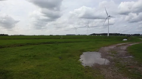Wind turbines in rainy field Stock Footage 42031987