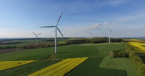 Wind Turbines in rape field from above Video stock 62897724