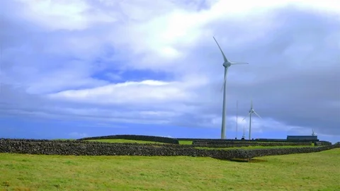 Wind Turbines. Renewable energy at Eolic Park, Azores. Sky with clouds Stock Footage 116562875