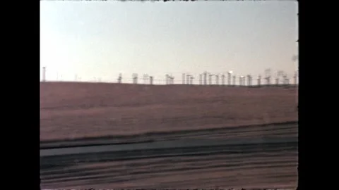 Wind Turbines on Rolling Hills Stock Footage 276291890