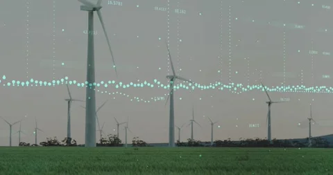 Wind turbines rotating, driven by wind, while teal data overlay animating to Stock Footage 333900991