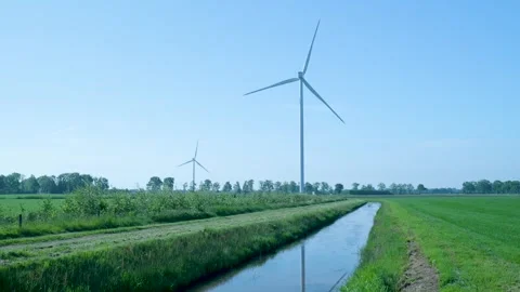 Wind turbines rotating in a green dutch rural landscape Stock-Footage 336902964