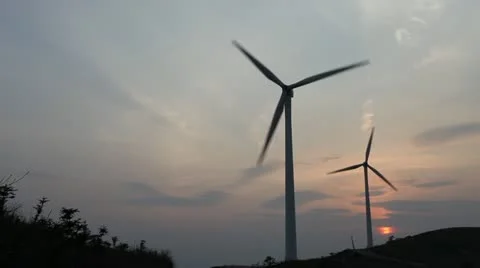 Wind turbines rotating on hill Stock Footage 22148911