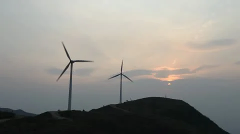 Wind turbines rotating on hill Stock Footage 22148930