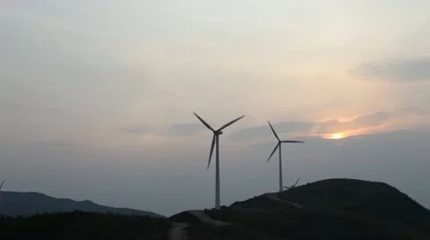 Wind turbines rotating on hill Stock Footage 22149059
