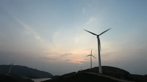 Wind turbines rotating on hill Stock Footage 22149338