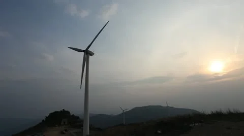 Wind turbines rotating on hill Stock Footage 22149405