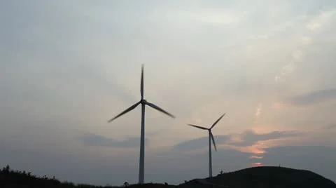 Wind turbines rotating on hill Stock Footage 22149443