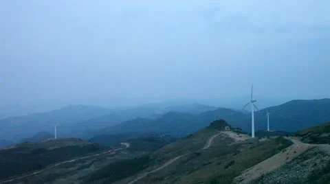 Wind turbines rotating on hill Stock Footage 22149546