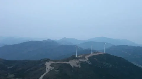 Wind turbines rotating on hill Stock Footage 22149712
