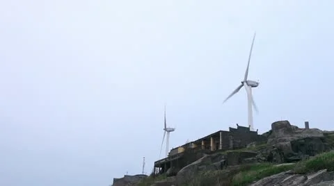 Wind turbines rotating on hill Stock Footage 22149899