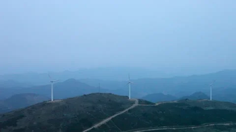 Wind turbines rotating on hill Stock Footage 22151060