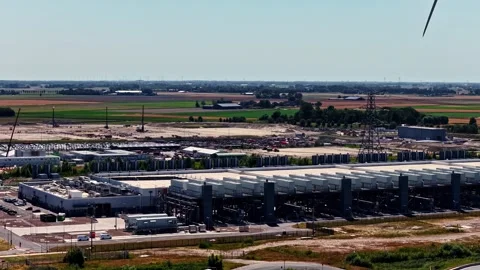 Wind turbines rotating at large data center in Eemshaven, Netherlands Stock Footage 344425836