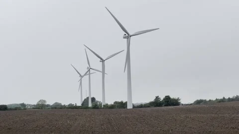 Wind turbines rotating on overcast day Stock-Footage 335477784