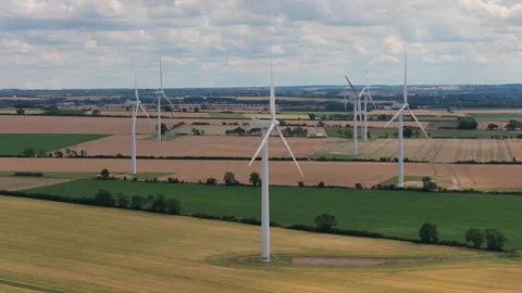 Wind Turbines Rotating in Rural Fields on a Bright Sunny Day During the 库存影片 341838165