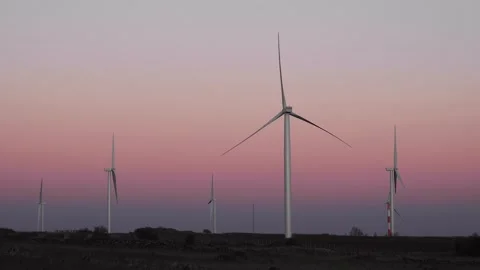 Wind turbines rotating at sundown spinning at dusk Stock Footage 170724086