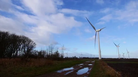 Wind turbines rotating on a windy day in an English countyside landscape 스톡 동영상 84058863