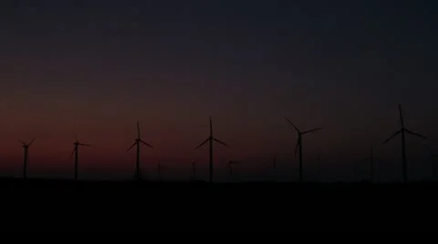 Wind turbines in a row at twilight Stock Footage 21272163
