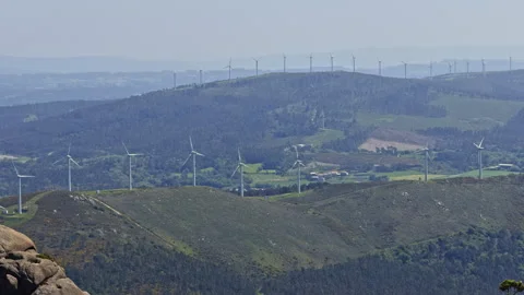 Wind turbines on a rural hillside Stock Footage 338295102