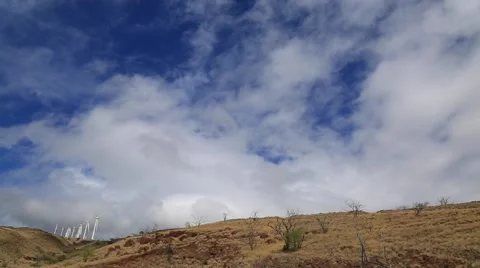 Wind turbines, scenic view, blue sky, hills Stock Footage 57403091