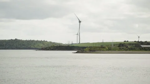 Wind turbines by the sea Video stock 241525513