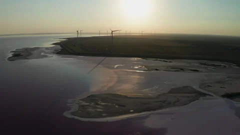 Wind turbines on the seashore at sunset. Green energy concept. Stock Footage 145521156