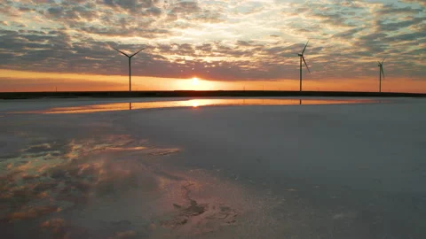 Wind turbines on the seashore at sunset. Green energy concept. 動画素材 148082811