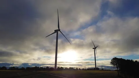 Wind Turbines Silhouette at Sunset with Clouds – Renewable Energy Concept 库存影片 324624256