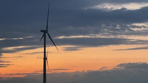 Wind Turbines Silhouetted Against Dramatic Sunset Sky Stock Footage 335810925