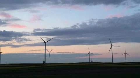 Wind Turbines Silhouetted Against Dramatic Sunset Sky Stock Footage 335811006