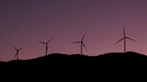 Wind Turbines Silhouetted at Sunset Stock Footage 282927165