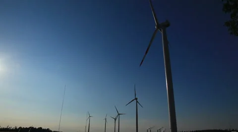 Wind turbines silhouettes spinning Stock Footage 35908408