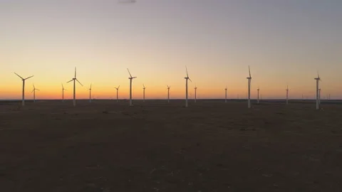Wind turbines silhouettes working against sunset sky at the Black Sea coast Stock Footage 138797876