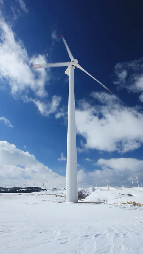 Wind Turbines, Snowfields, and Flowing Clouds Video stock 324967461