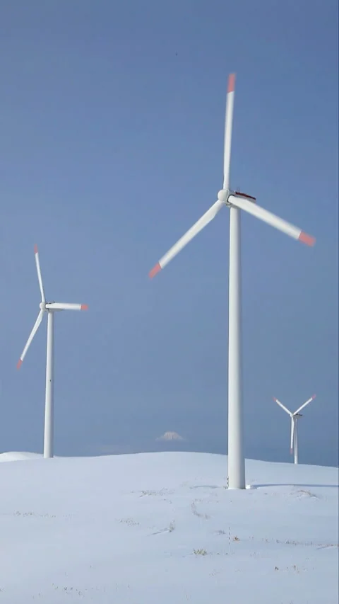 Wind Turbines, Snowfields, and Mount Rishiri Video stock 324960325
