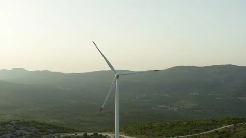 Wind turbines span mountain ridges in an aerial industrial landscape 스톡 동영상 197250414